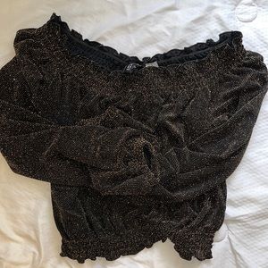 Black and gold shimmer off the shoulder top.
